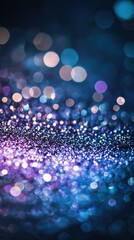Sparkling glitter texture in purple blue and silver on dark background