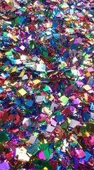 Fototapeta premium Vibrant confetti texture on glossy surface a celebration of color