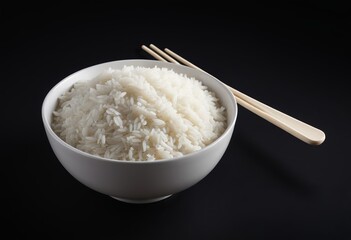 A bowl of white rice in a black background