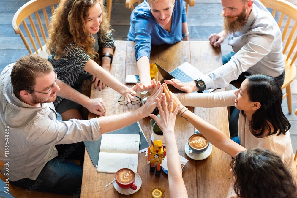 Poster group of diverse people high five around table with coffee and notebooks, showing teamwork and colla