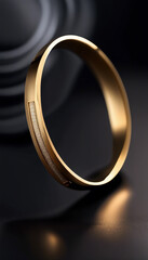 A photograph showcasing a minimalistic gold bracelet adorned with a diamond, reflecting elegance and luxury against a dark background. Perfect for concepts of fashion, beauty, or premium jewelry.

