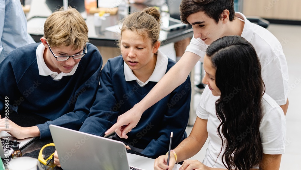 Aufkleber Diverse group of students collaborate in science lab. Diverse students, teamwork, and learning in school classroom. Diverse students collaborate in science class, teamwork group project at school