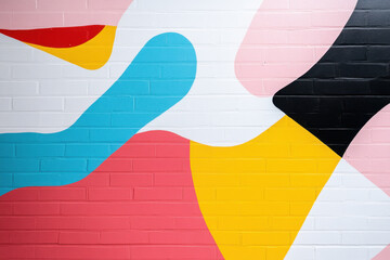 Modern urban street art graffiti on white painted brick wall. Abstract geometric Memphis style graffiti background