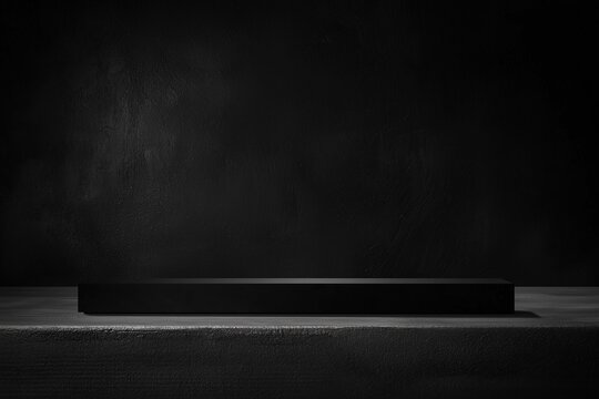 Black empty podium on dark background ideal for product presentation, minimalist stage setup for showcasing items, sleek and professional display platform
