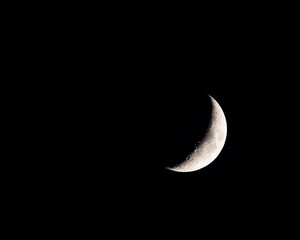 The waxing crescent moon in early January of 2025. Many of the seas or maria on the moon are visible, including Mare Nectaris, Mare Tranquillitatis, and Mare Crisium, as well as the many craters.