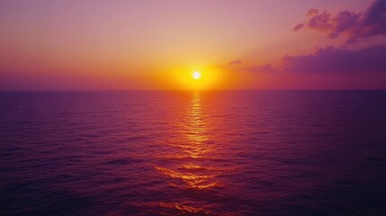 Fototapeta premium Vibrant Sunset Over Calm Ocean Waters