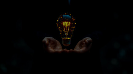 Businessman holding a light bulb with digital icons of energy and technology for a sustainable power concept