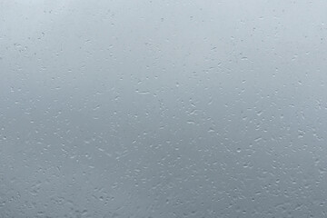 Raindrops on window glass. Rainy weather.