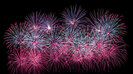 Obraz premium Colorful celebration fireworks isolated on a black sky background.