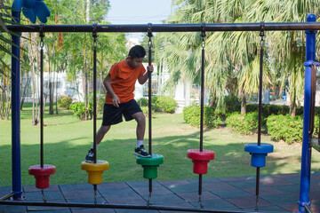 A boy is having fun in the park.