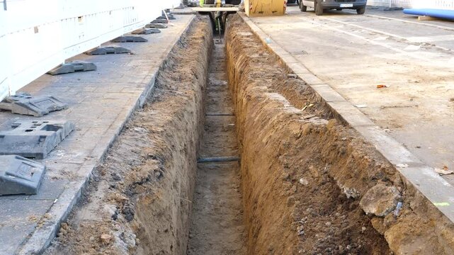 Construction site and pipe laying in the city center