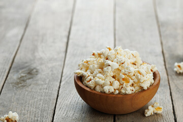 popcorn in bowl on table with copy space