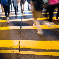 Busy people on zebra crossing street in Hong Kong