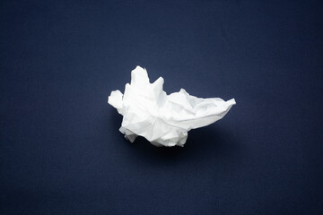 used tissue crumpled isolated on black