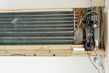 Front view of a disassembled air conditioner on the wall