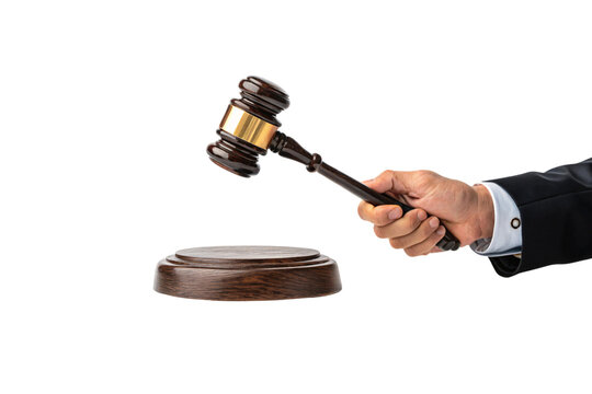 A polished wooden gavel with a golden band, grasped by a hand in formal attire, poised over a base, representing law and order. Isolated on a transparent background
