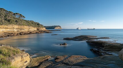 Coastal Rockscape with Distant Cargo Ships at Sea