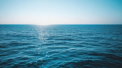 Obraz premium Serene Ocean Surface Under a Clear Sky