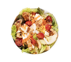 bowl of fresh salad with cubes of tomato chicken and lettuce isolated in close up top view