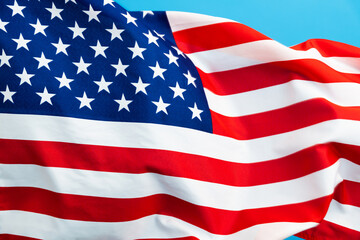 American flag waving on blue background
