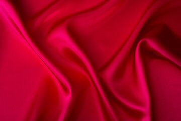 Close up of dark red silk background