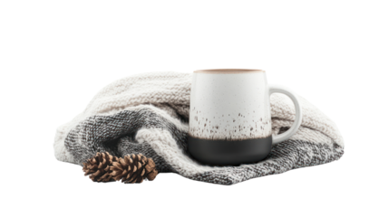 A cozy coffee mug wrapped in a soft blanket, accompanied by pine cones, perfect for a warm, inviting atmosphere.