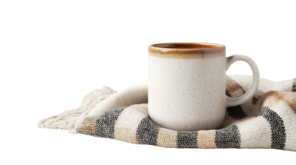 A cozy scene featuring a warm beverage in a textured mug placed on a soft, striped blanket, perfect for a relaxing environment.