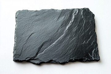 A piece of dark gray slate rock, is isolated against a white background.