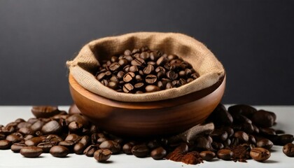 Fototapeta premium coffee beans in a cup on burlap