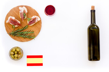 Welcome to Spain. Parma ham and Spanish flag, top view