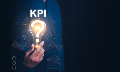 A businessman holding a glowing question mark next to the acronym "KPI," symbolizing inquiry into key performance indicators in a business context.