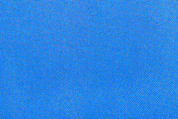 a close-up of a blue fabric featuring a fine textured pattern.