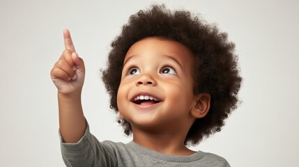 Curious boy points upwards, exploring the wonders of imagination and discovery 