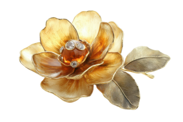 Elegant golden flower accessory with amber stone and leaf detail, showcasing intricate design
