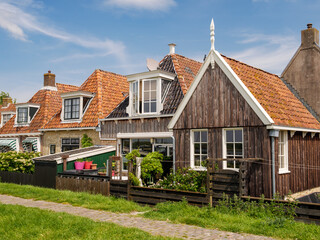 Dyke and backyards of historic houses in old town of Makkum, Friesland, Netherlands