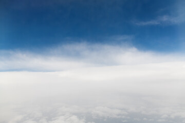 Looking at the clouds and sky on the plane