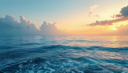 Obraz premium Ocean Waves Rolling Under a Colorful Sunset Sky with Soft Clouds