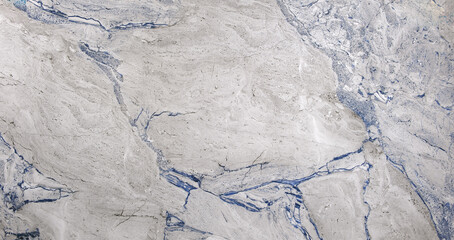A large, white and blue stone with a blue streak. The stone is very smooth and has a very clean look