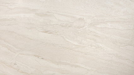 A white marble wall with a pattern of small dots. The wall is smooth and has a clean, minimalist look