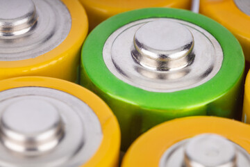 Close up of colorful AA batteries in a row