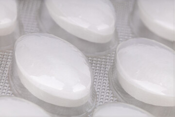 Close up of white tablets in blister pack
