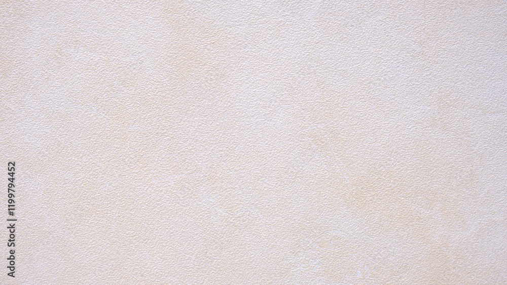 Poster a white wall with a few small dots on it. the wall is very plain and unadorned