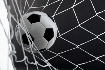 Soccer ball goal success on black background