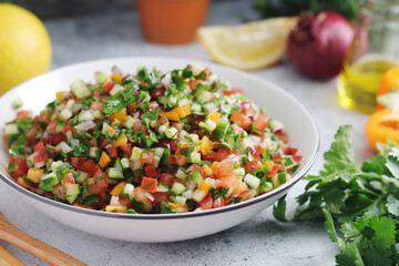 A bowl with traditional Israelian Salad