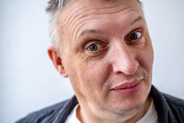 distorted face of sad and grieved very upset person, dissatisfied with his hard fate
