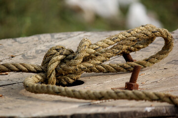 close up shot of twisted rope in the field	