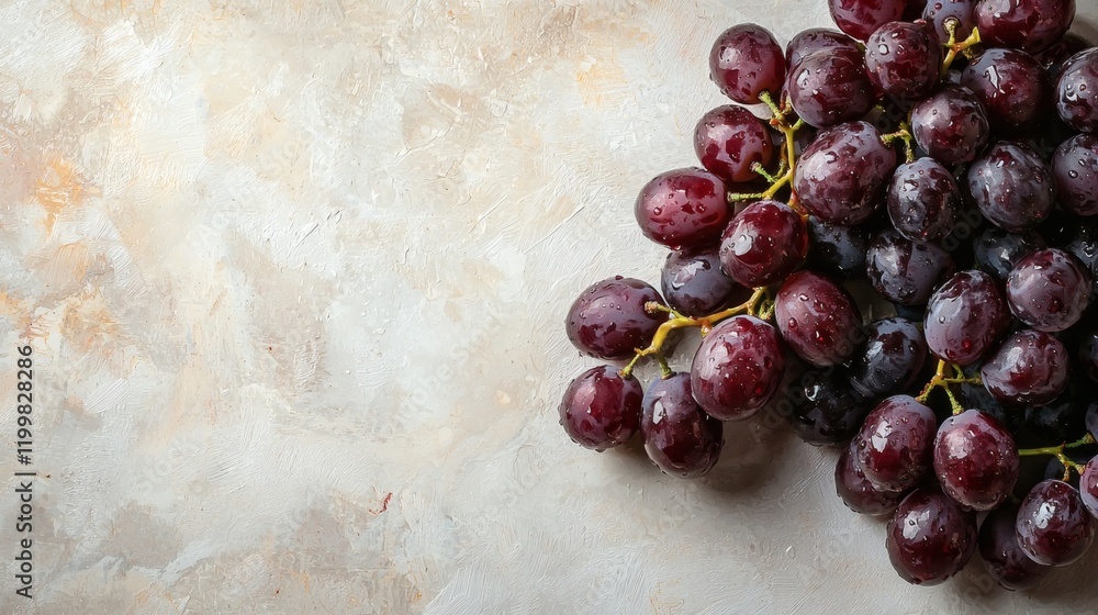 Poster isolated of freshly washed black grapes with water droplets visible arranged on a flat white surface