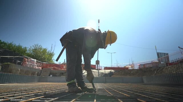 Construction Workers in Action: Building Foundations on a Sunny Day