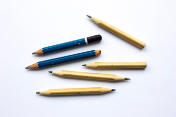 A group of wooden pencil isolated on white background. Wooden pencils are commonly used for children in school.