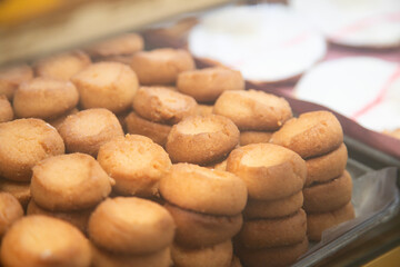 Traditional sweets stand with empanadas, cocadas, mamones in the Oaxaca food market.